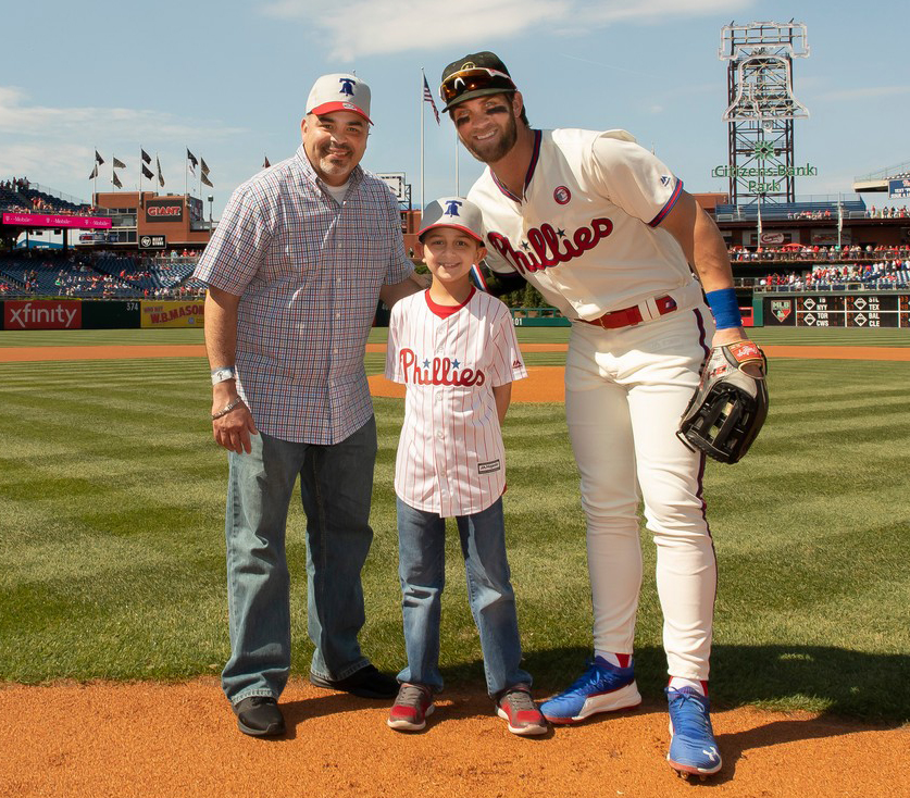 boy and father with Phillies player