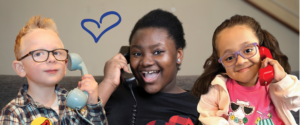 three kids answering telephones